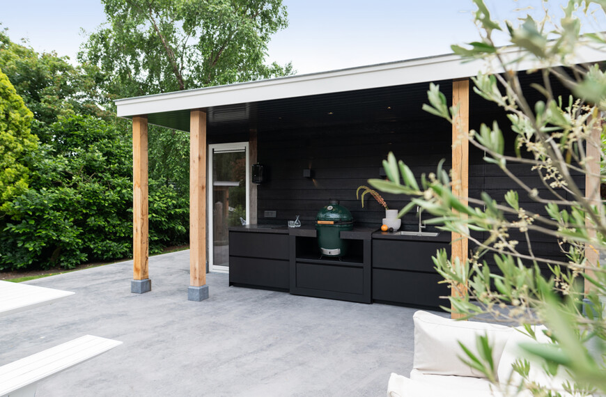 black outdoor kitchen with big green egg