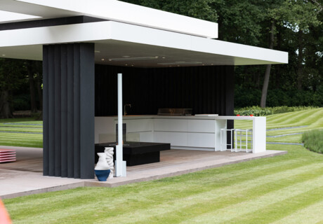 Outdoor kitchen with full cocktail bar in a modern garden room